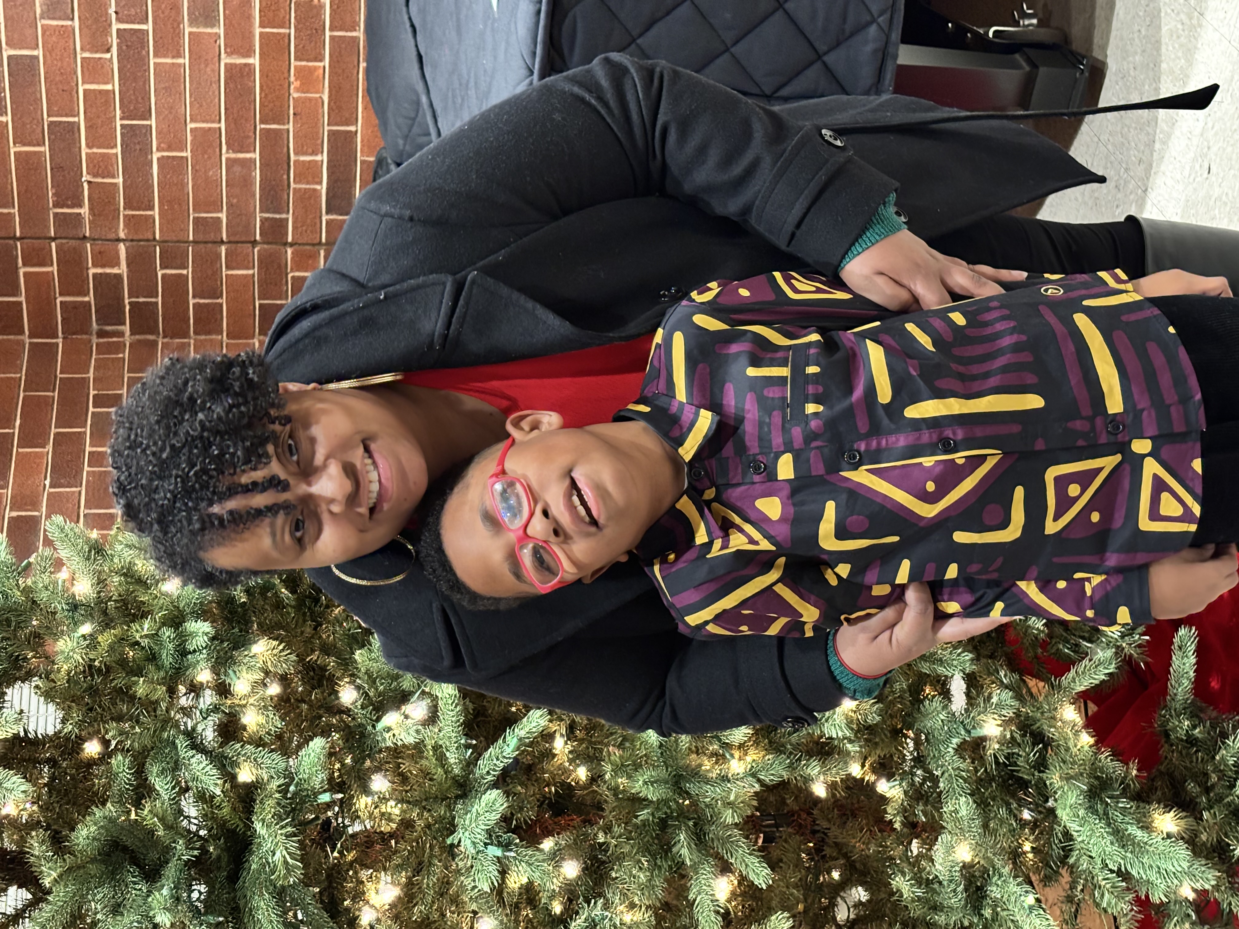 A board member with a camper celebrating the holidays